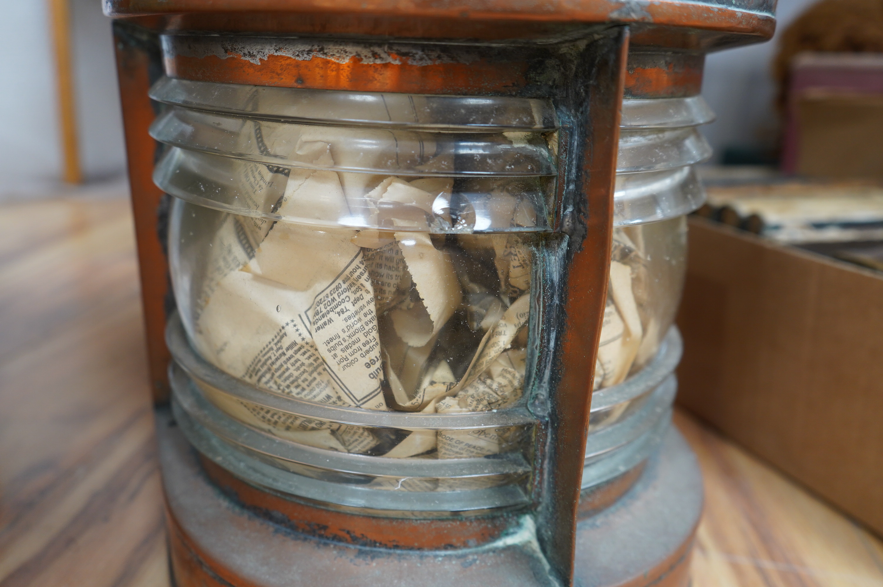 An early 20th century ship’s copper mast head lamp, 69cm high. Condition - fair